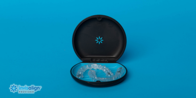 Invisalign dentist explaining teen aligner treatment at College Street Dentistry